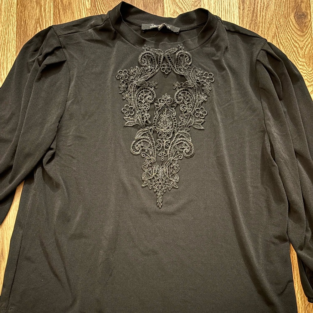 Elegant Black Long Sleeve Top with Embroidered Design